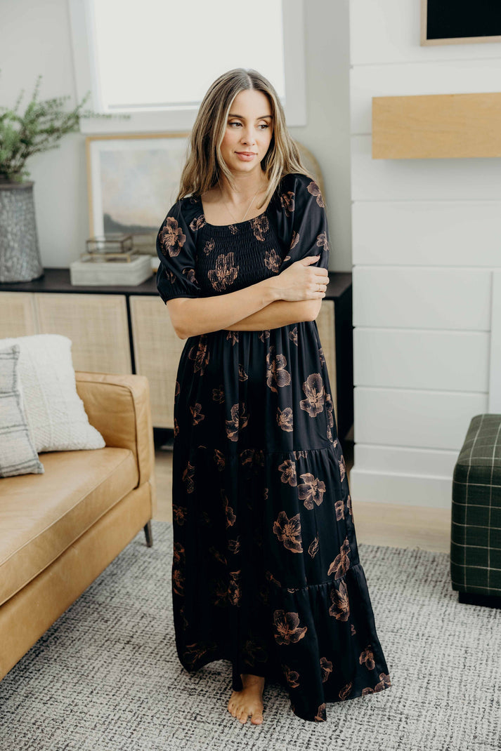 Full-length tiered maxi dress with smocked bodice and puff sleeves