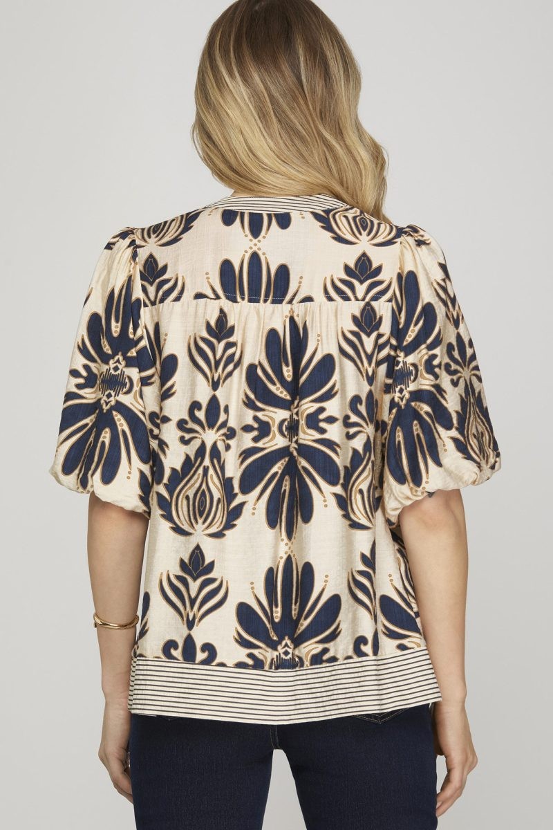 Detail view of back and print design on woven top