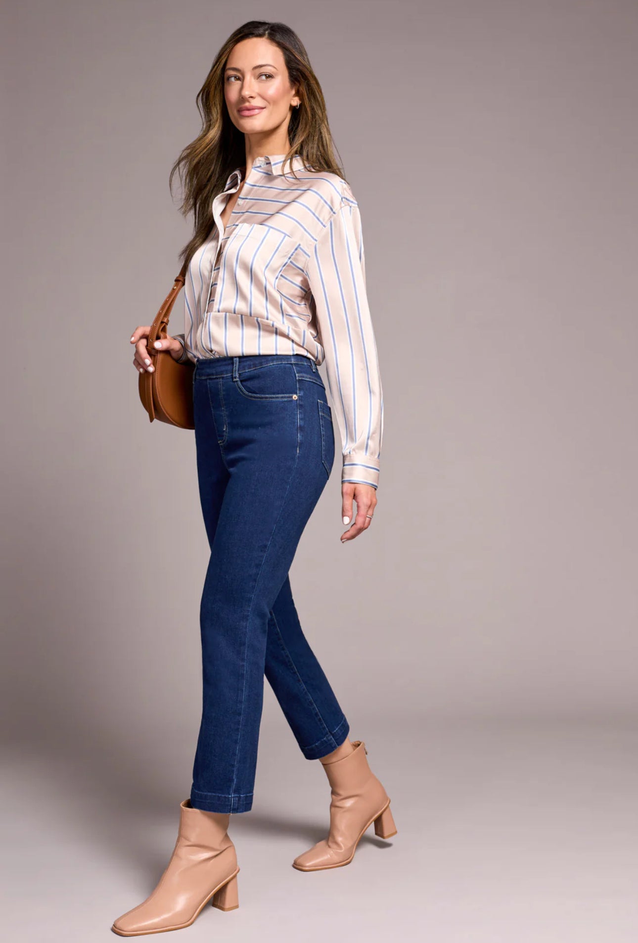 Women’s mid-rise pull-on straight leg jeans in comfort stretch denim with crease detail and 26-inch inseam.