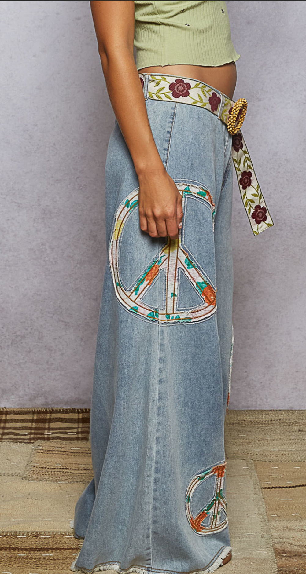 Side view of women’s wide leg jeans with raw edge hem and outseam double gauze detail