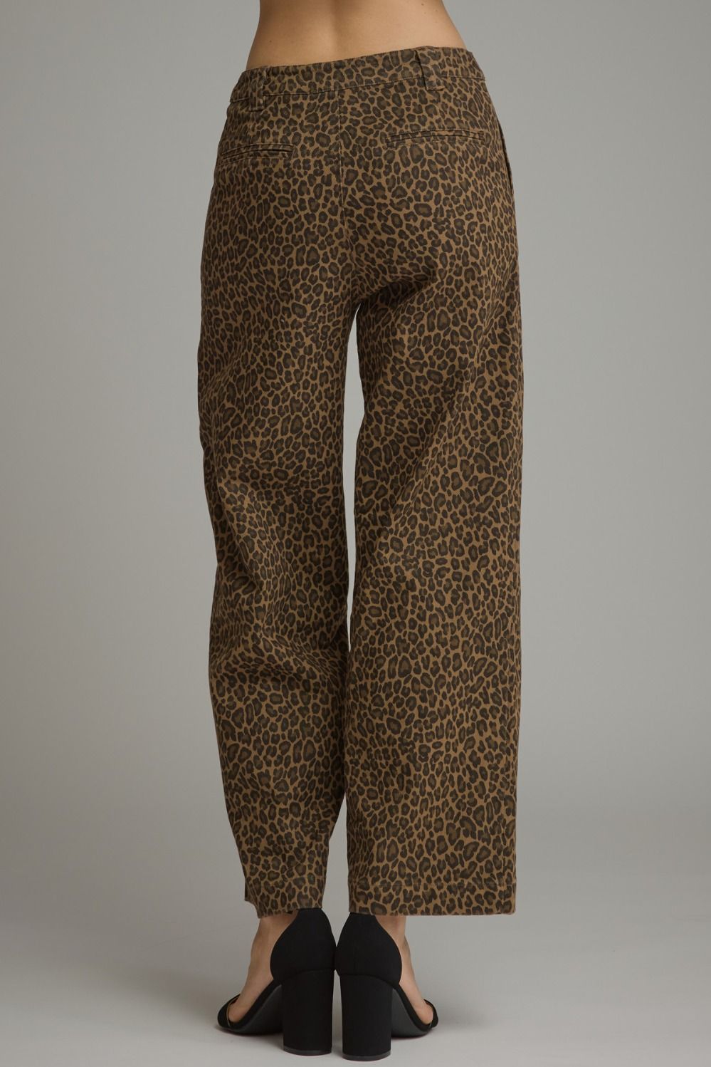 Entro- Animal print wide leg pants with belt loops and zip-fly button front closure. Front patch pockets