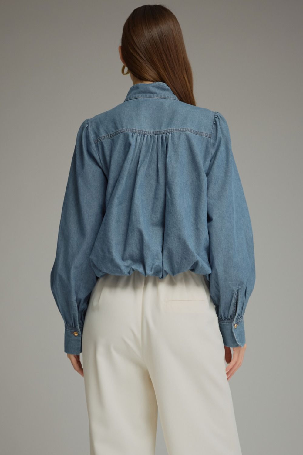 Entro-Solid long sleeve denim top with a high neckline and button closure at front