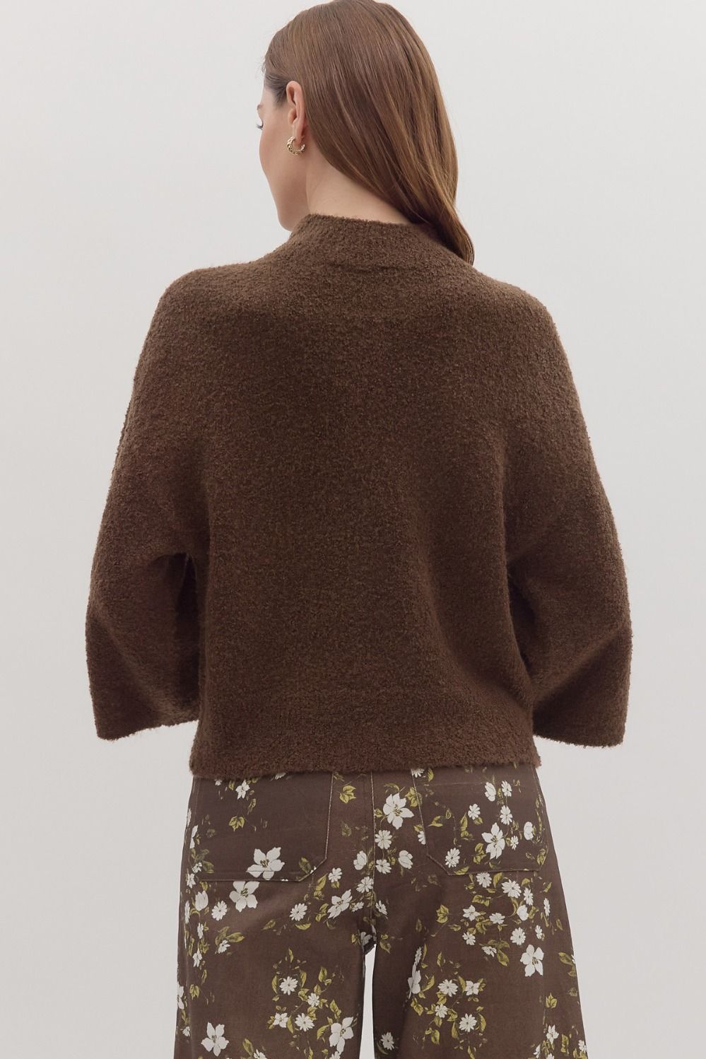 Back view of solid knit sweater top