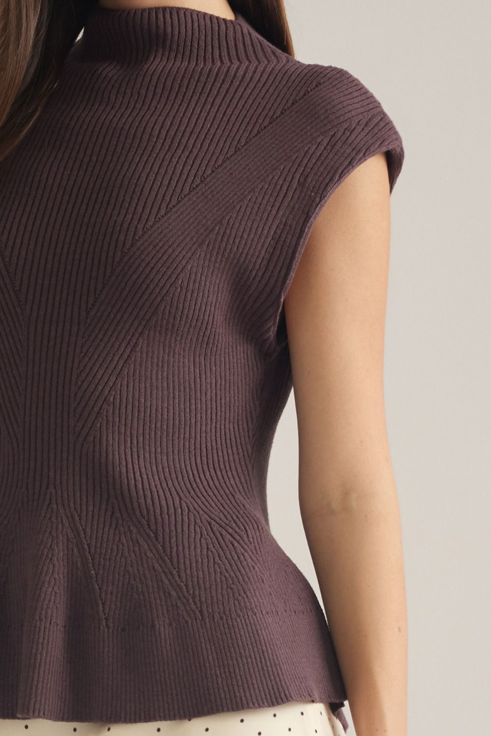 Entro-Solid cap sleeve knit top with a mock neck.