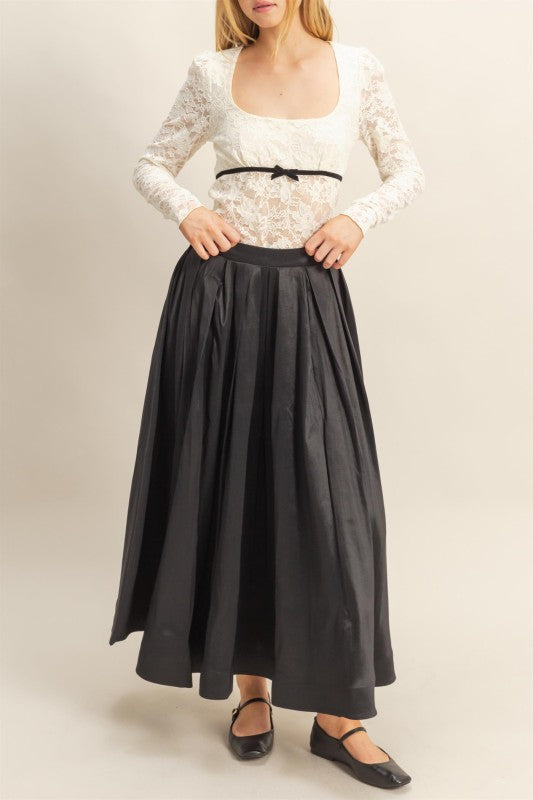 Classic pleated A-line silhouette for office or evening wear