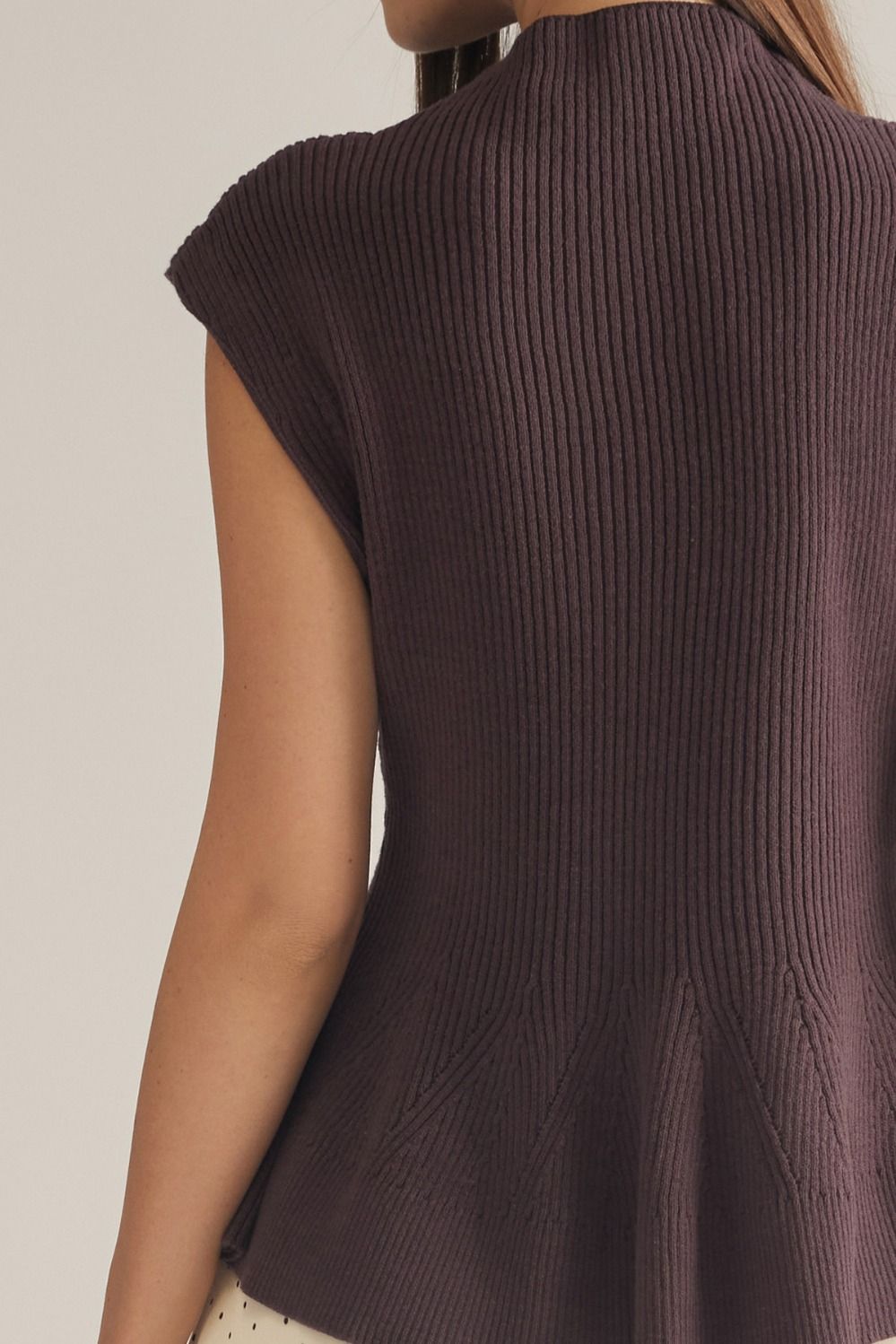 Entro-Solid cap sleeve knit top with a mock neck.