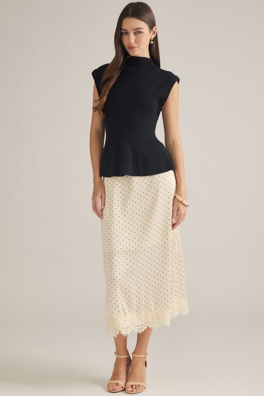 Entro-Solid cap sleeve knit top with a mock neck.