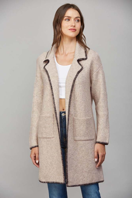 Front view of contrast whipstitch notched collar open cardigan