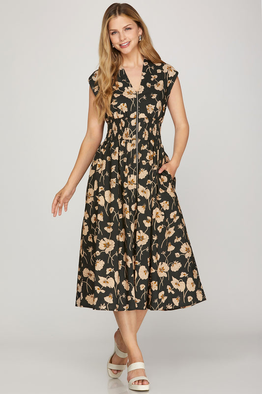 Stay stylish and comfortable in this drop shoulder floral midi dress featuring a smocked waist, zip front detail, and side pockets. 100% cotton with soft lining—perfect for everyday wear.
