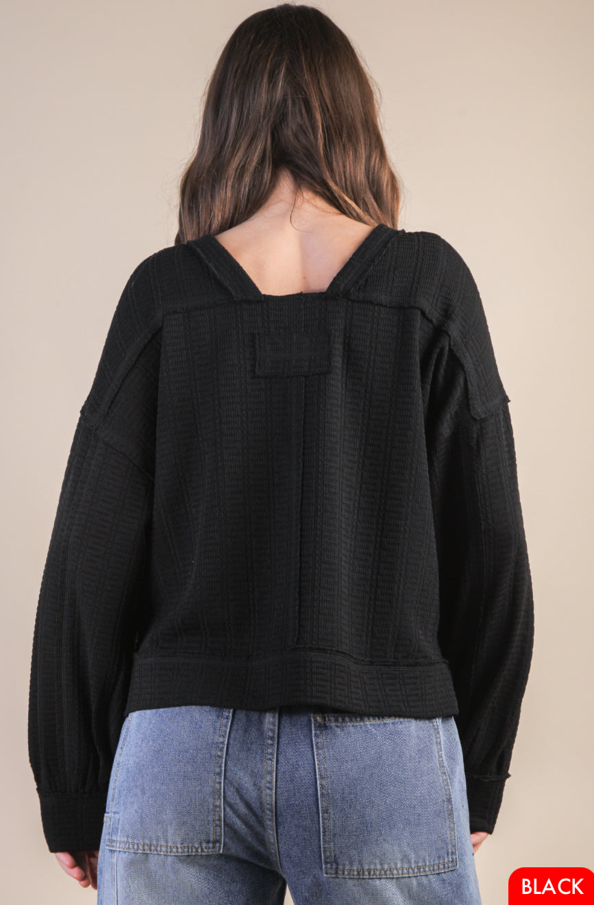 Back view of square neck knit top in textured fabric