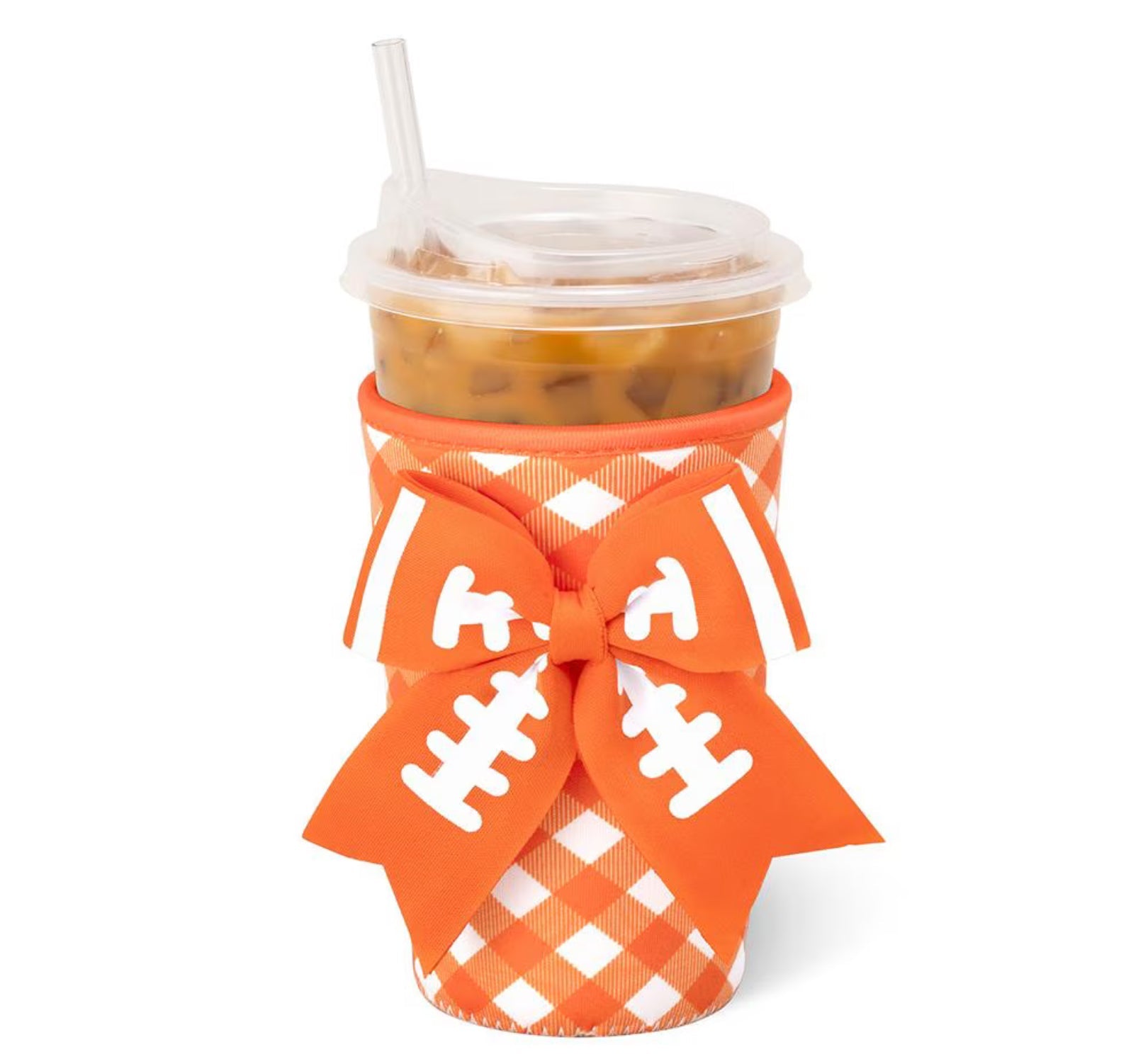 An orange and white buffalo check insulated cup sleeve with a large orange and white football-themed bow, holding an iced coffee in a clear plastic cup with a straw, on a white background.