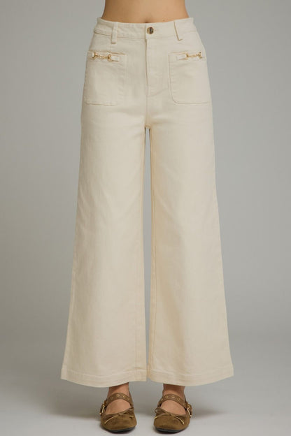 Entro-Solid wide leg pants featuring a zip-fly button front closure. Front patch pockets with hardware accent. Decorative back welt pockets. Belt loops.