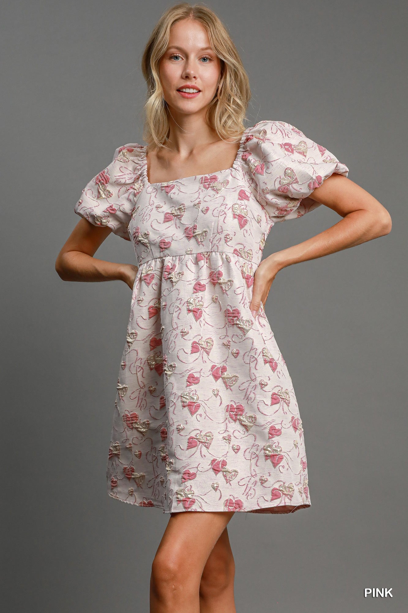 Square neckline detail on pink jacquard mini dress