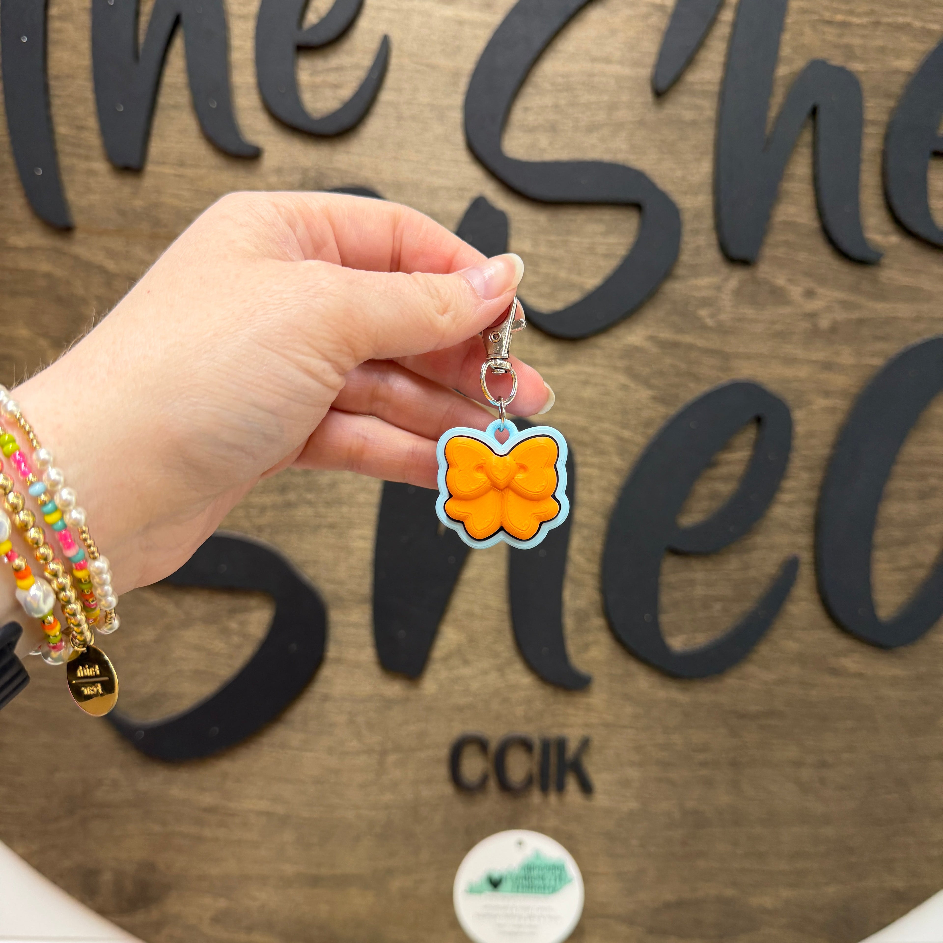 Mandarin Orange/Light Blue Bow Fidget Clicker Keychain