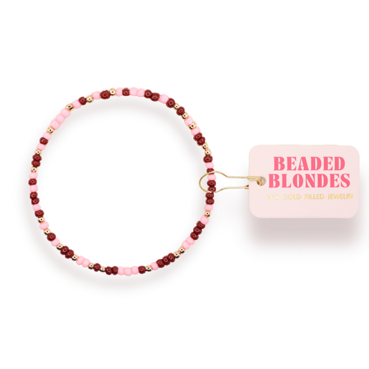Beaded hair tie with 'Beaded Blondes' packaging on a white background