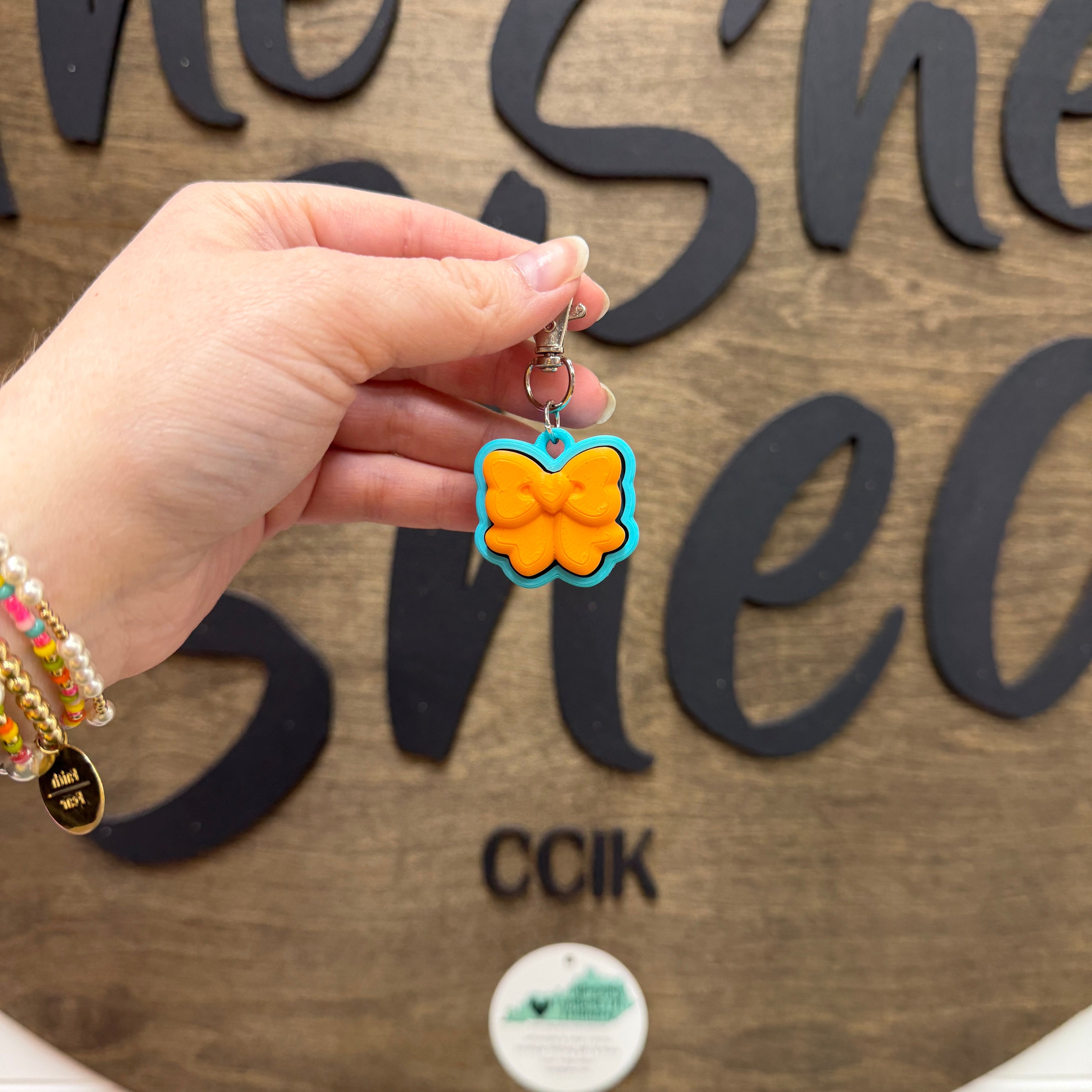 Mandarin Orange/Turquoise Bow Fidget Clicker Keychain