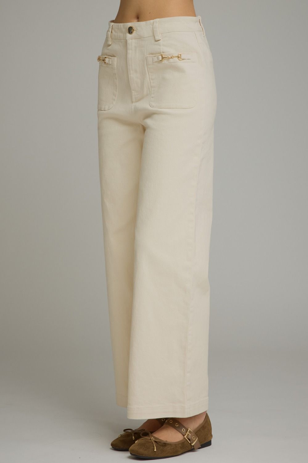 Entro-Solid wide leg pants featuring a zip-fly button front closure. Front patch pockets with hardware accent. Decorative back welt pockets. Belt loops.