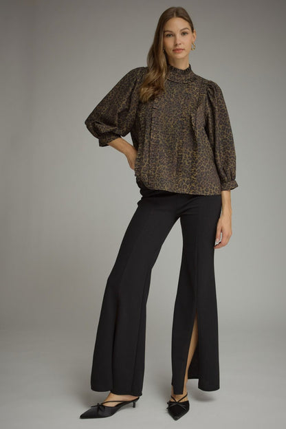 Entro-Animal print ¾ balloon sleeve top with a ruffle stand collar. Ruffle trim detail at front. Back keyhole with button closure. Gathered detail at back.
