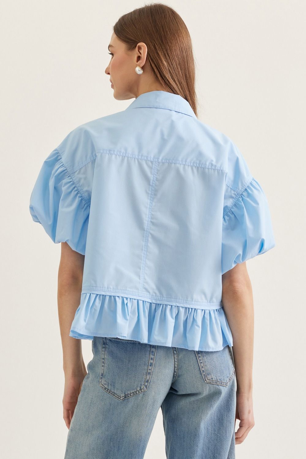 Entro Solid short puff sleeve top featuring ruffle hem detail.