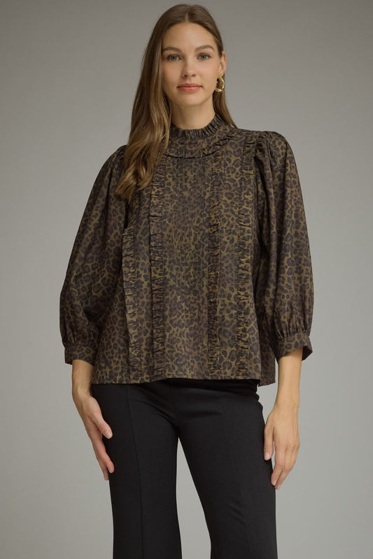 Entro-Animal print ¾ balloon sleeve top with a ruffle stand collar. Ruffle trim detail at front. Back keyhole with button closure. Gathered detail at back.