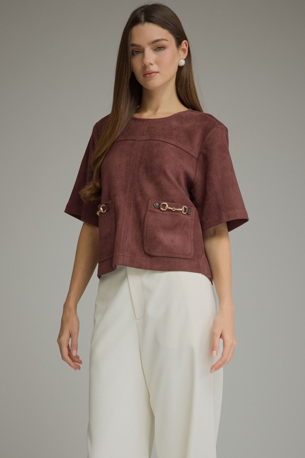 Entro-Solid short sleeve top with a boat neckline and front patch pockets. Metal hardware detail at pockets.