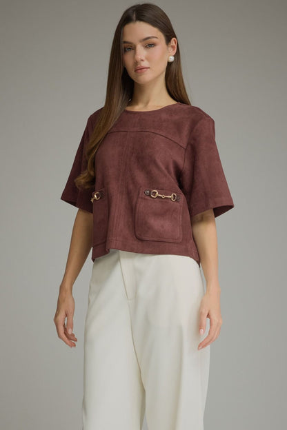 Entro-Solid short sleeve top with a boat neckline and front patch pockets. Metal hardware detail at pockets.