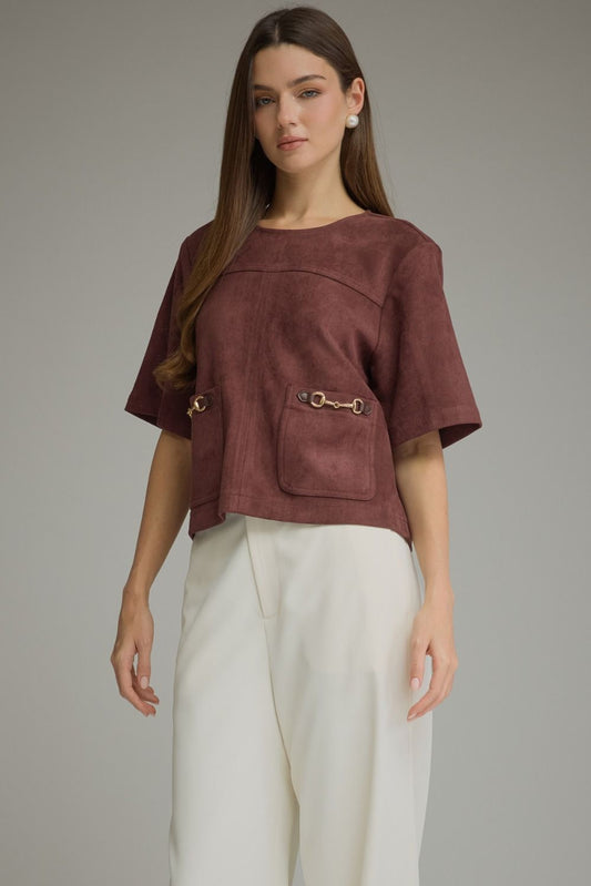 Entro-Solid short sleeve top with a boat neckline and front patch pockets. Metal hardware detail at pockets.