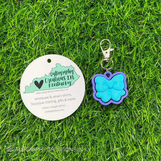 Turquoise/Purple Bow Fidget Clicker Keychain