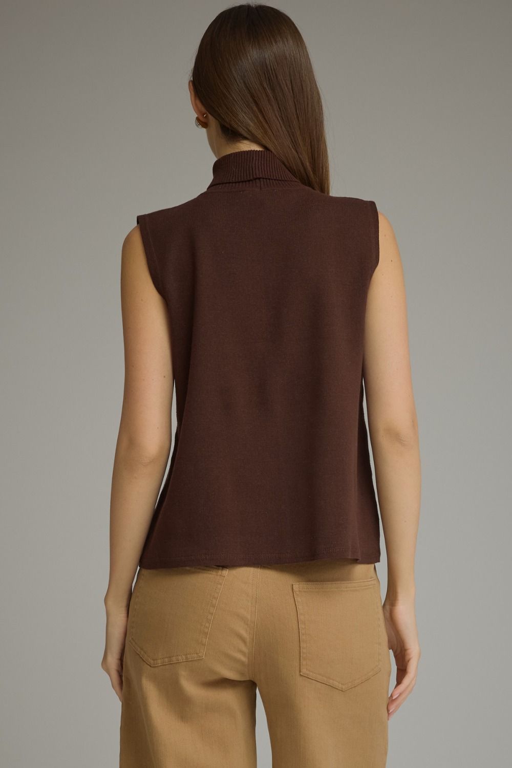 Entro-Solid sleeveless turtleneck top.