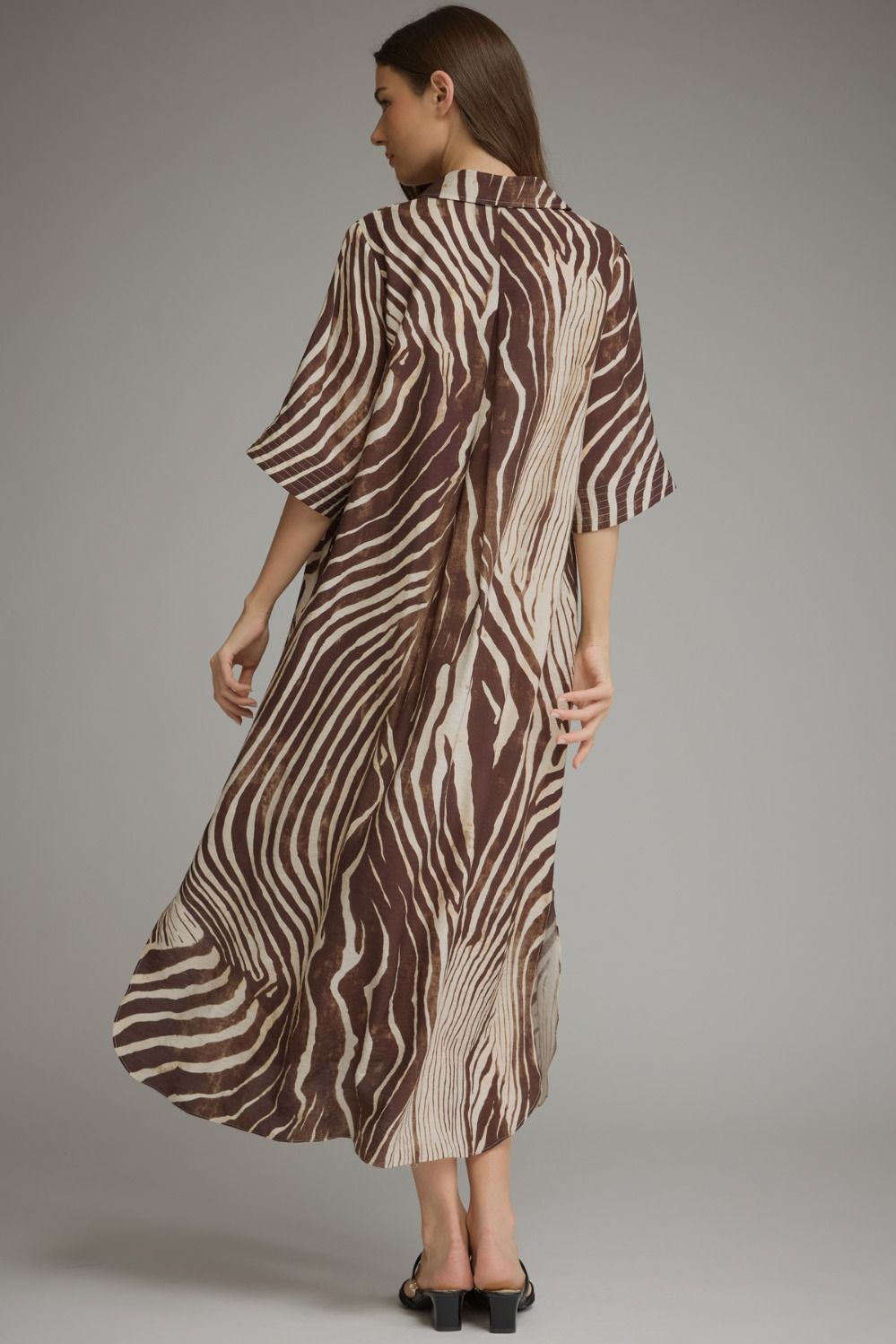 Entro- Abstract zebra print elbow sleeve midi dress featuring a split neckline