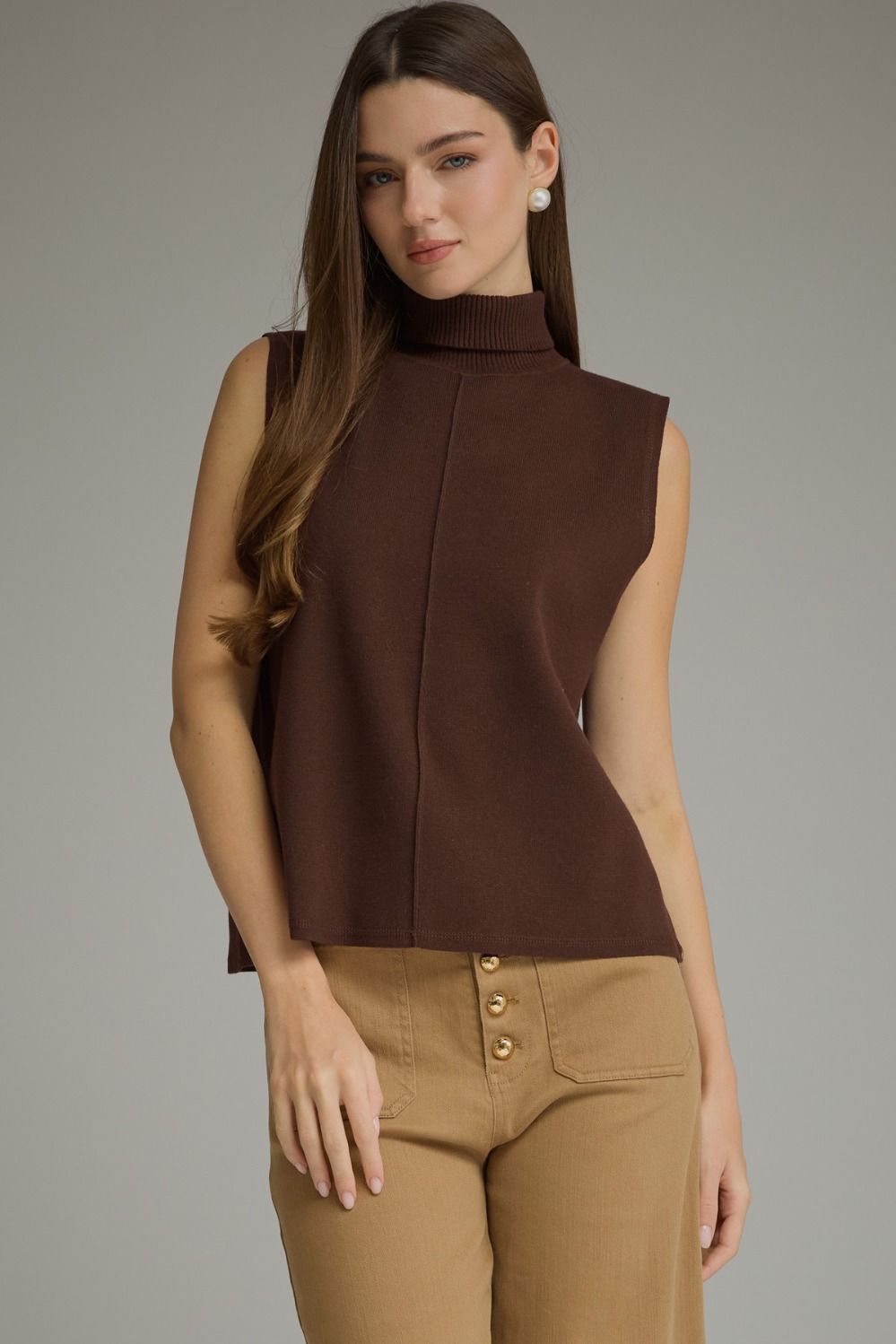 Entro-Solid sleeveless turtleneck top.