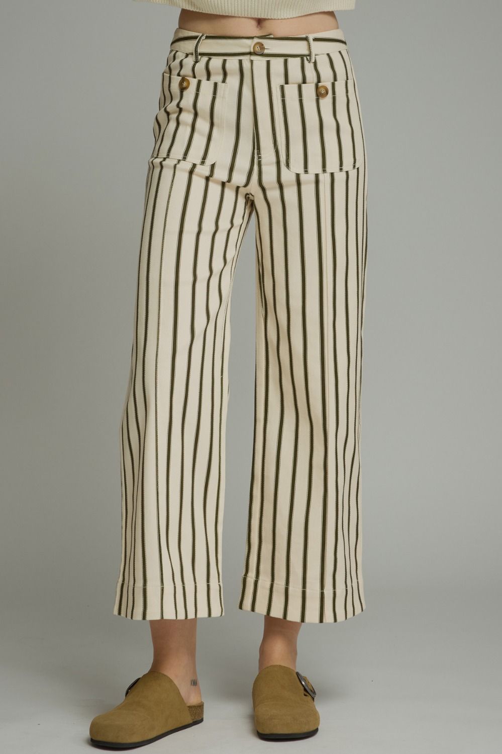 Entro-Stripe ankle-length pants featuring front pockets with button detail. Belt loops. Zip-fly button front closure. Back pockets.