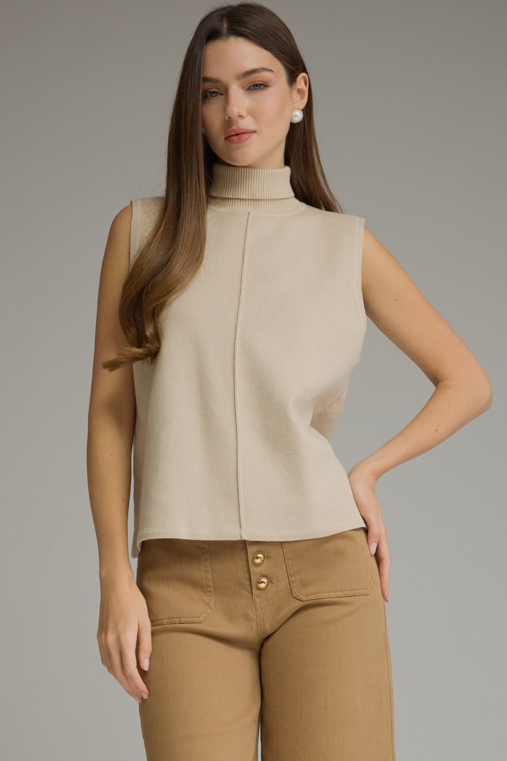 Entro-Solid sleeveless turtleneck top.