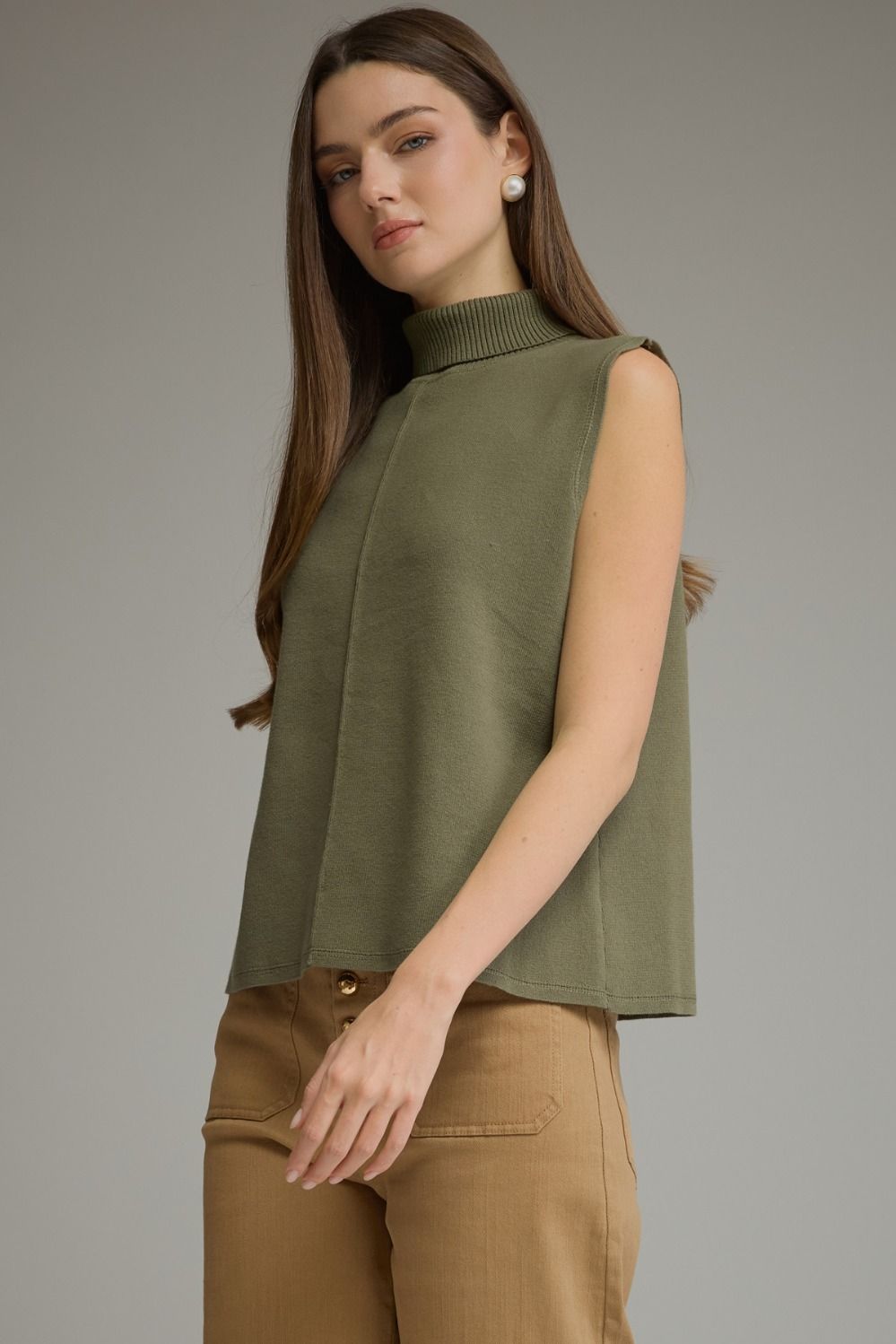 Entro-Solid sleeveless turtleneck top.