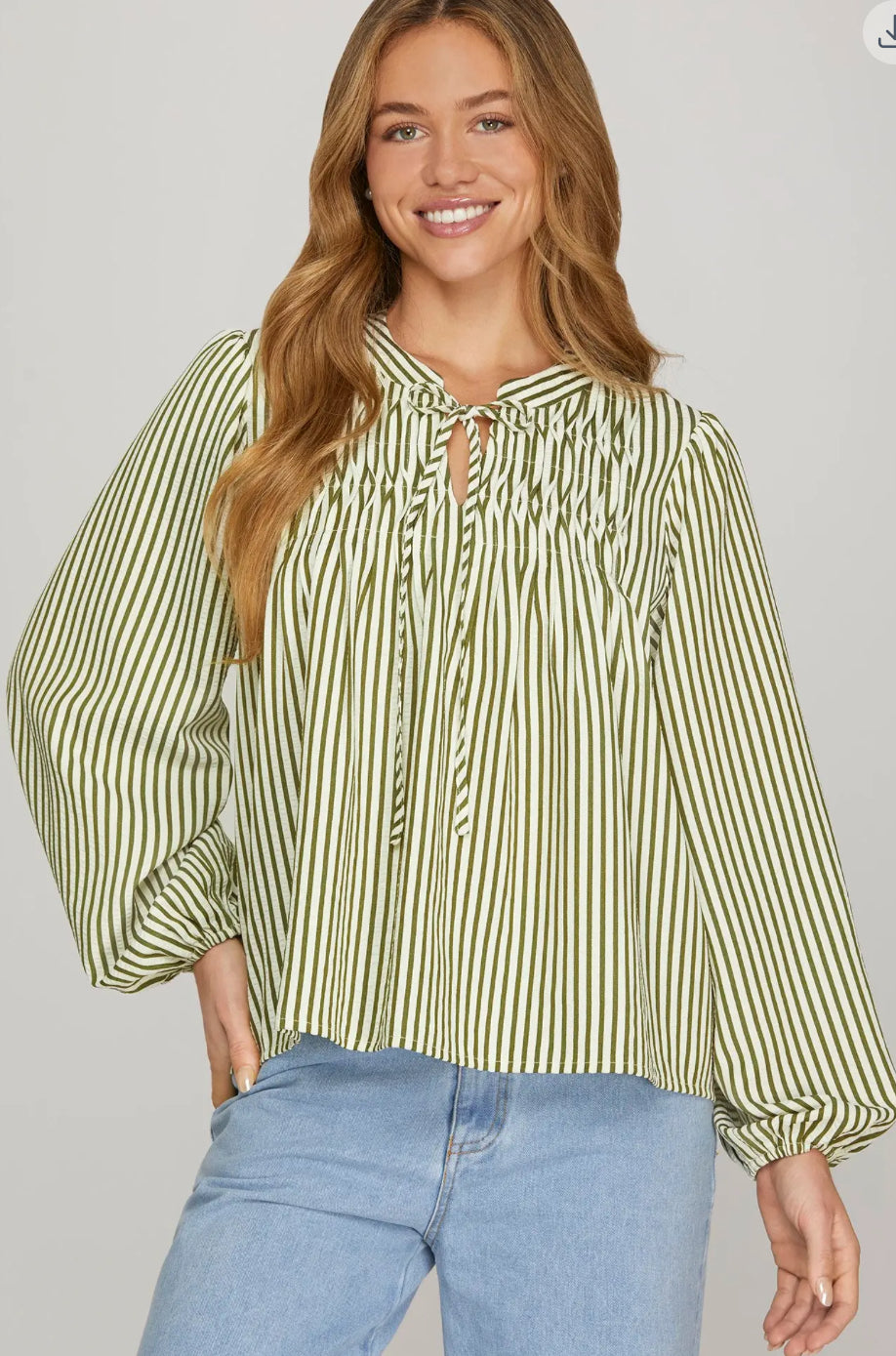 Front view of women’s striped woven blouse with pintuck detail and tie