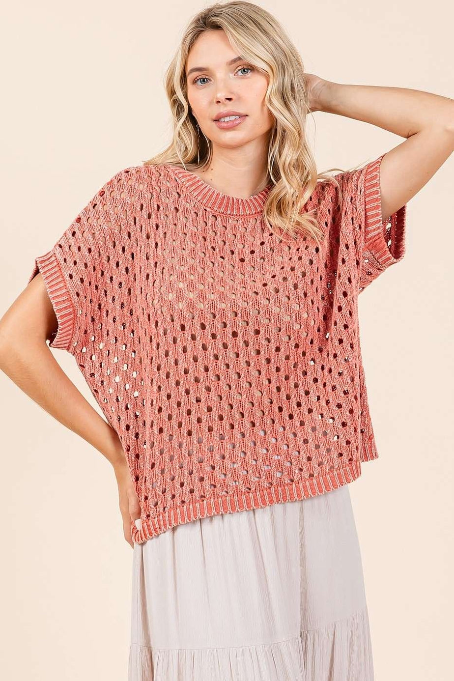 Woman wearing mineral washed crochet open knit pullover sweater top