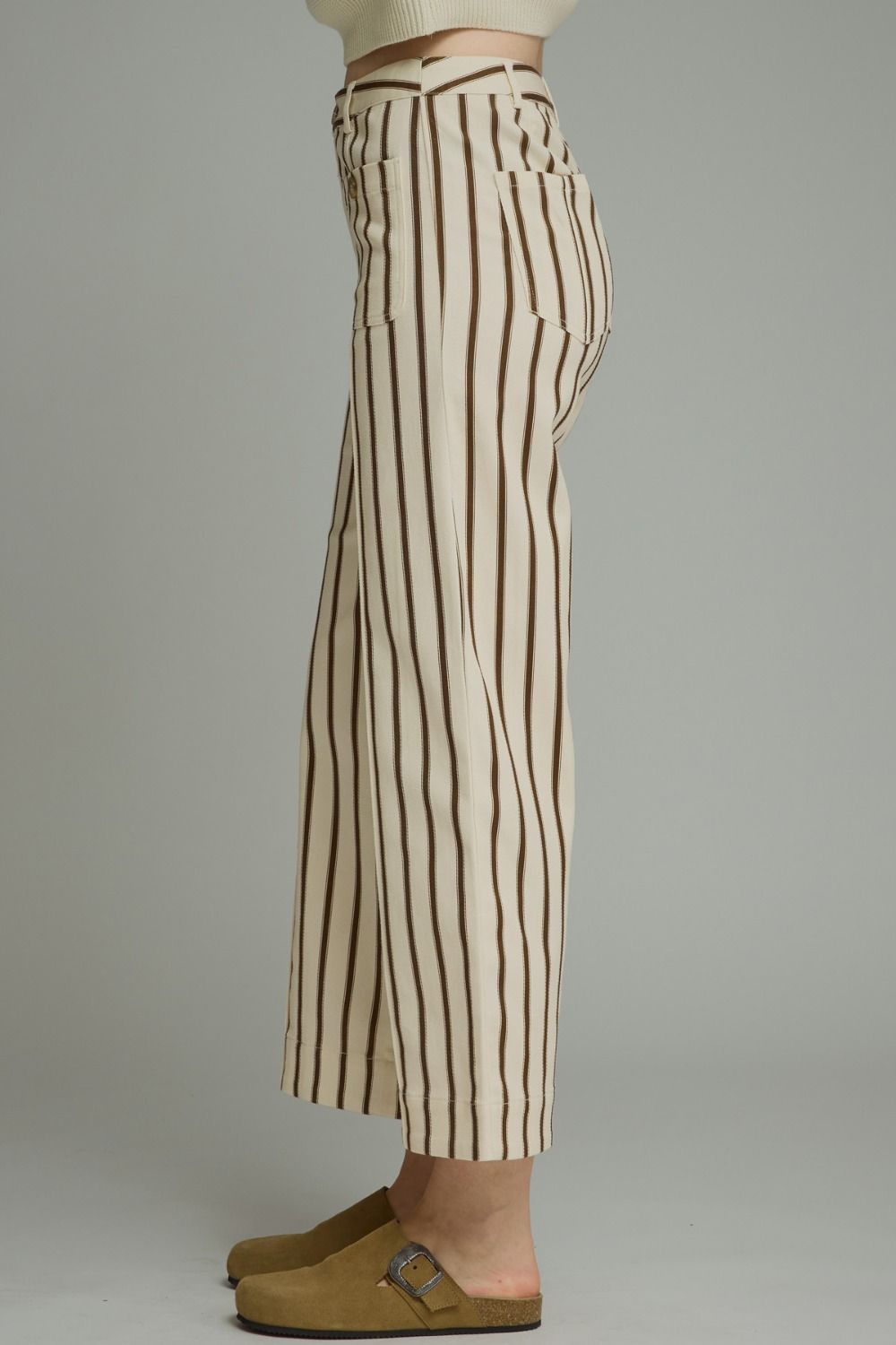 Entro-Stripe ankle-length pants featuring front pockets with button detail. Belt loops. Zip-fly button front closure. Back pockets.