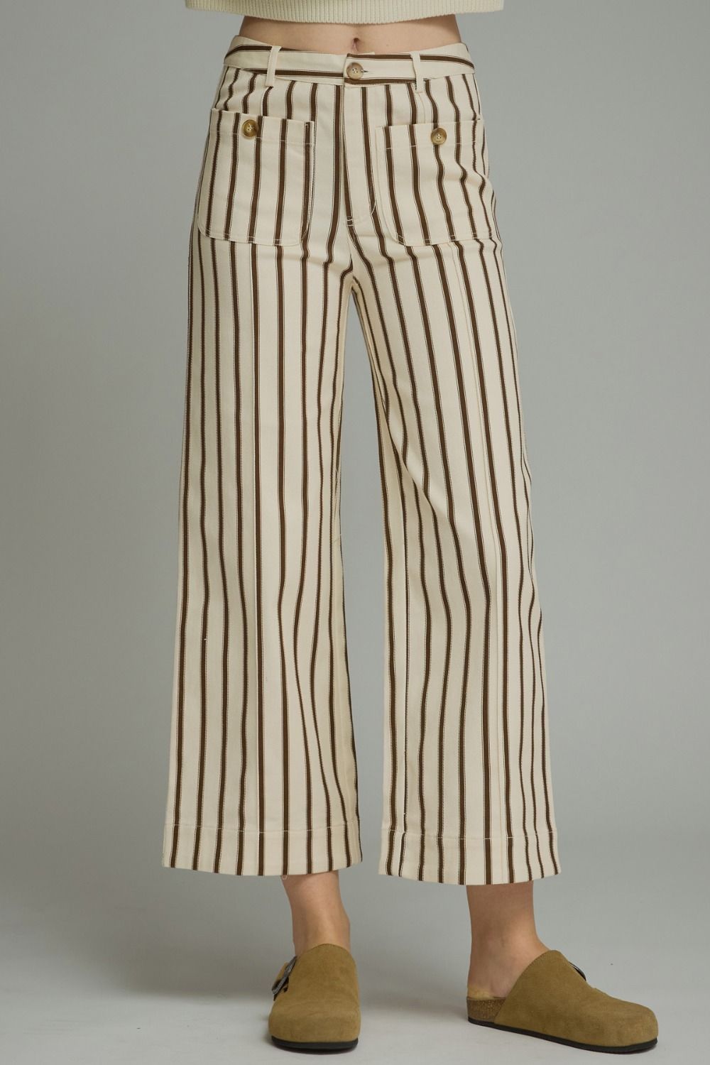 Entro-Stripe ankle-length pants featuring front pockets with button detail. Belt loops. Zip-fly button front closure. Back pockets.