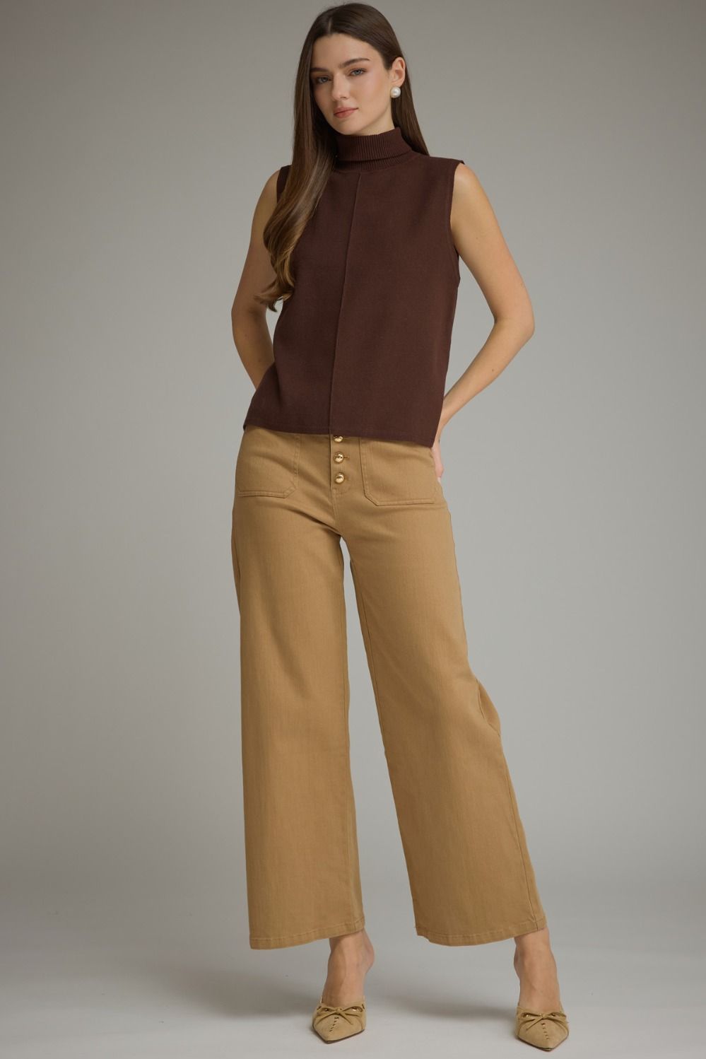 Entro-Solid sleeveless turtleneck top.