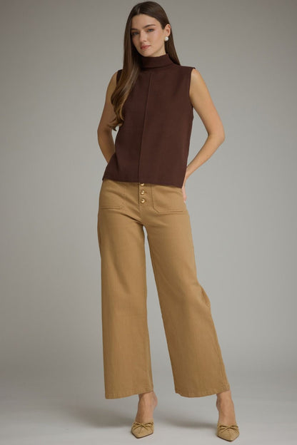 Entro-Solid sleeveless turtleneck top.