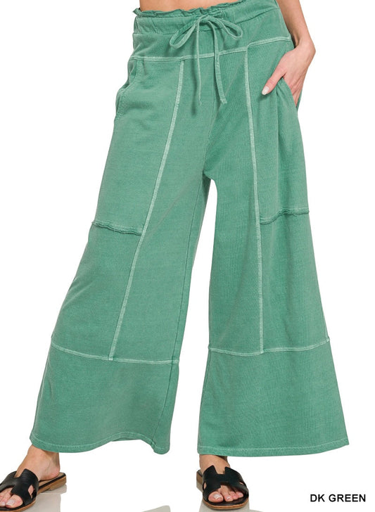 Dark green wide leg pants on a white background