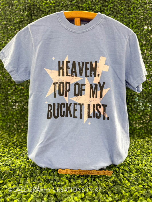 Washed denim color tee with a design that says heaven top of my bucket list with stars