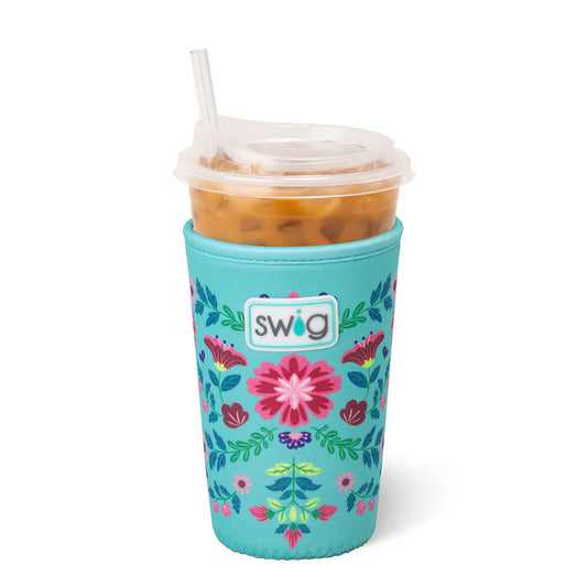 Teal floral-patterned cup with a drink inside on a white background