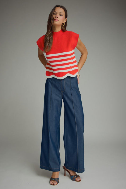 Entro-Stripe mock neck sleeveless sweater knit top featuring scallop hem.