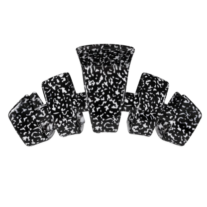 A set of six black and white marbled claw clip