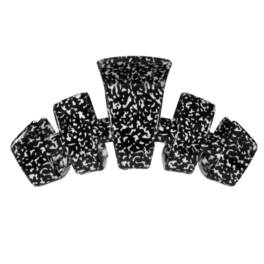 A set of six black and white marbled claw clip