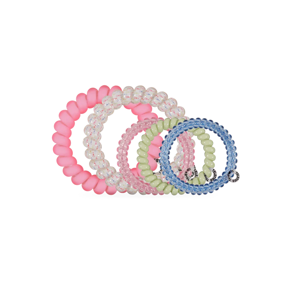 Set of colorful beaded hair ties on a white background