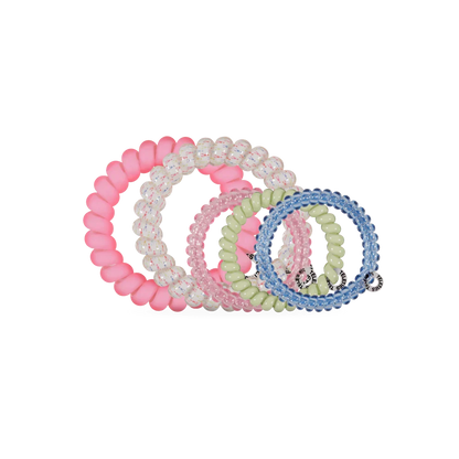 Set of colorful beaded hair ties on a white background