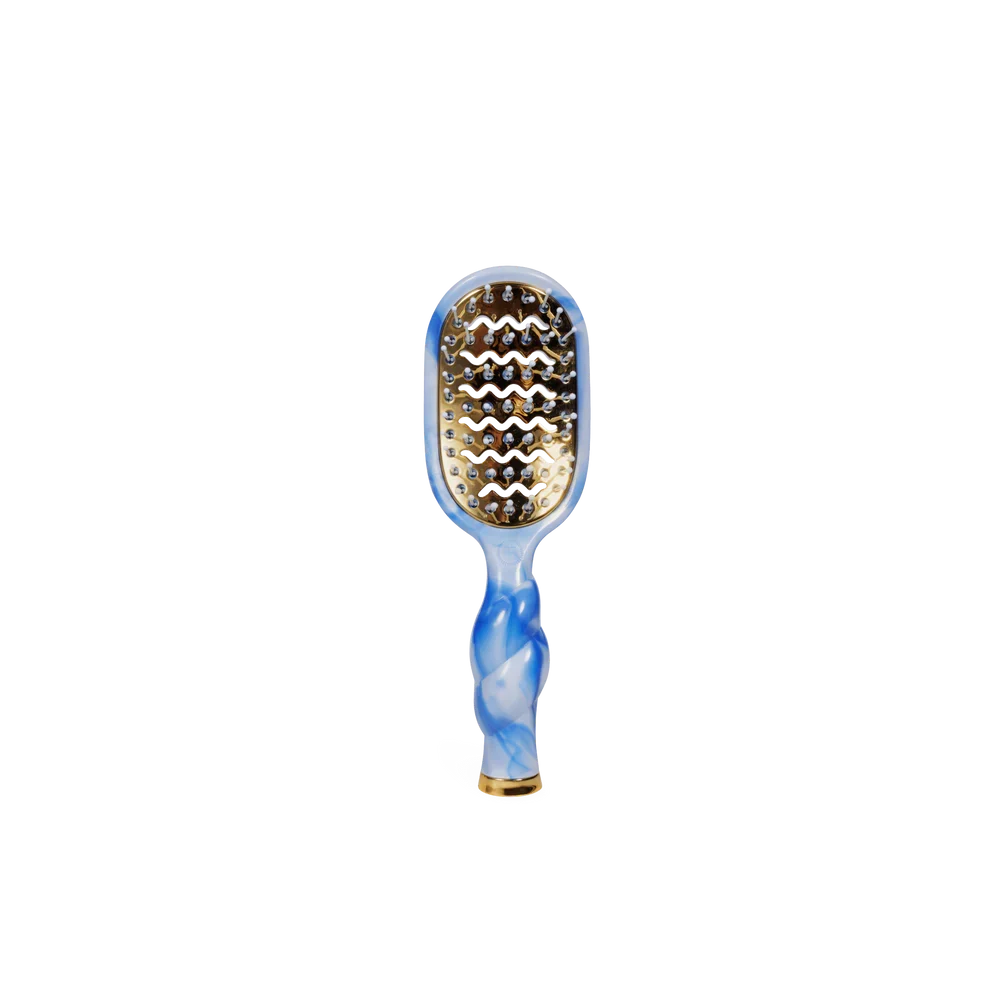 Paddle hairbrush with blue and white marbled handle on a white background