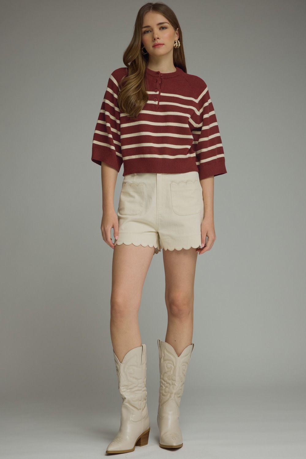 Entro-Stripe ¾ sleeve knit top featuring button closure at front.
